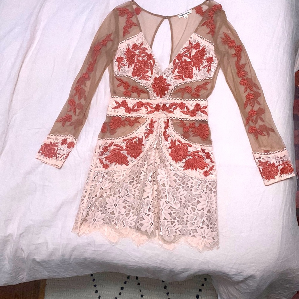 For love and lemons mini dress with mesh cutouts and floral appliqué. Size S